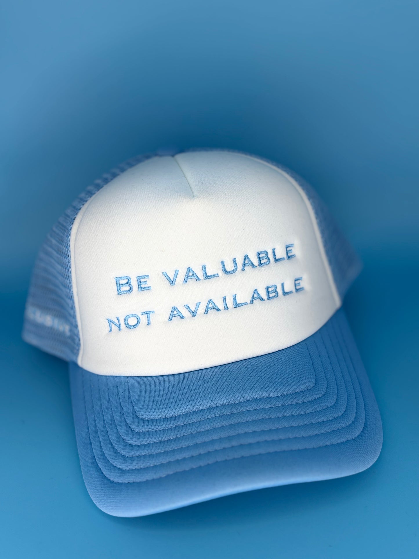 Baby blue “Be Valuable Not Available” Cap